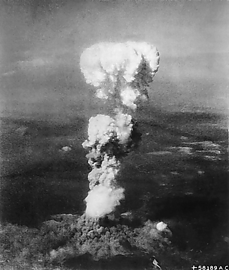 The Hiroshima mushroom cloud rising over the city, photographed minutes after the detonation on August 6, 1945