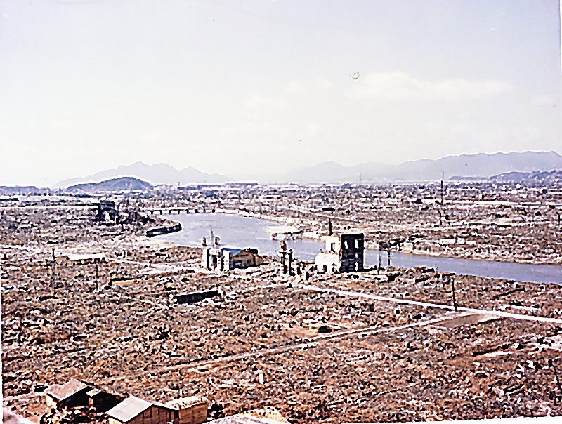 Aerial view of Hiroshima's leveled downtown along the Motoyasu River, photographed in color after the bombing