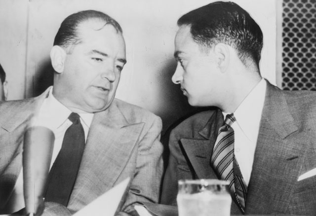 Senator McCarthy and chief counsel Roy Cohn confer during the Army-McCarthy hearings, 1954