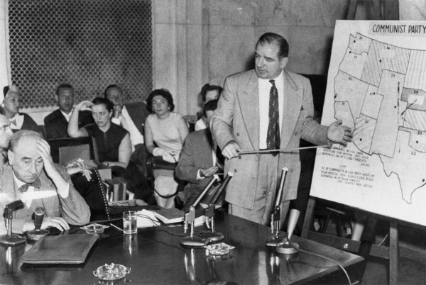 Senator McCarthy points to a Communist Party infiltration map during the Army-McCarthy hearings, 1954