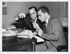 Nixon and Stripling examining Pumpkin Papers microfilm, December 1948